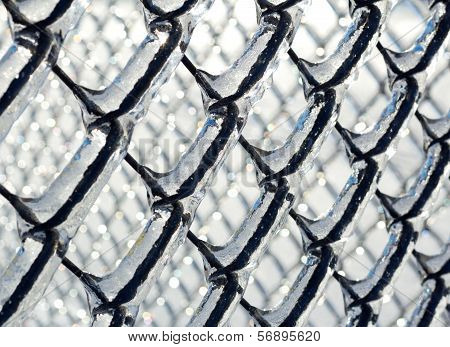 Ice coated chain link fence from an ice storm