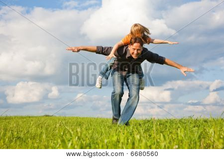 Father and kid playing together