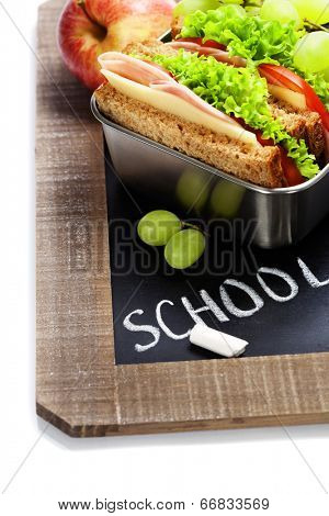 school lunch and  blank chalk board over white