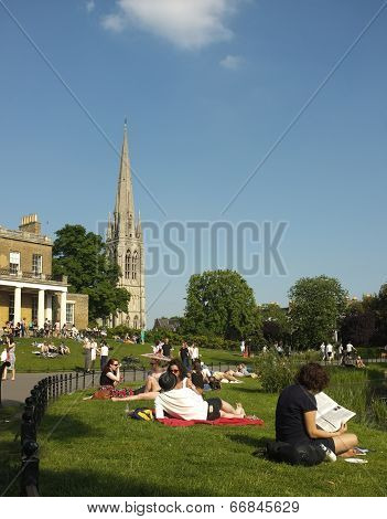 People on the grass in a local park