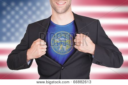 Businessman Opening Suit To Reveal Shirt With State Flag