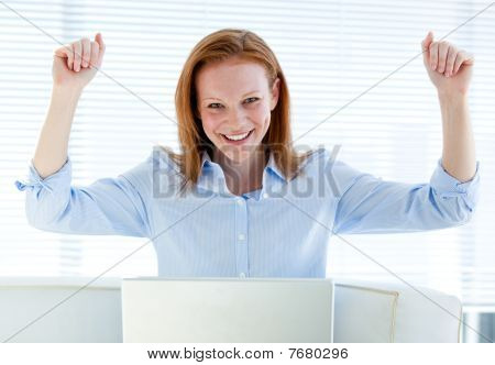 Bright Business Woman Punching The Air