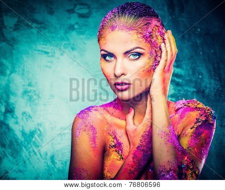 Beautiful young woman with conceptual colourful body art 
