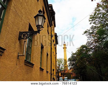 The wall of the old city with a street lamp