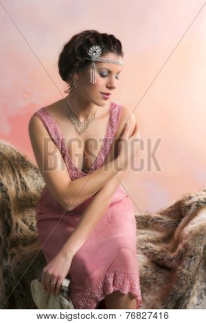 Closeup in vintage colors of a 1920s style young woman with diamond headdress and flapper dress
