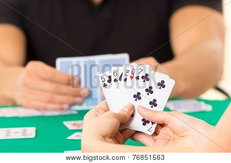 Playing cards closeup of hands holding deck