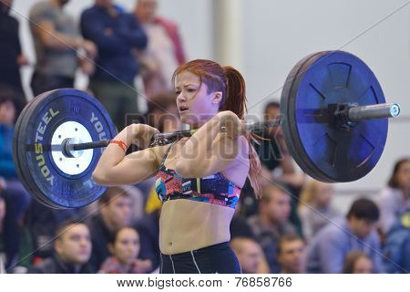 NOVOSIBIRSK, RUSSIA - NOVEMBER 16, 2014: Unidentified female athlete during the International crossfit competition Siberian Showdown. The competition is part of the festival Siberian Health.