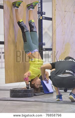 NOVOSIBIRSK, RUSSIA - NOVEMBER 16, 2014: Unidentified female athlete during the International crossfit competition Siberian Showdown. The competition is part of the festival Siberian Health.
