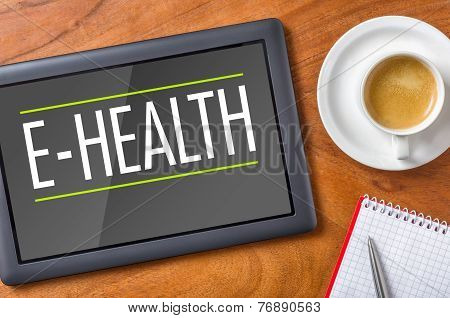 Tablet on a wooden desk - E-Health