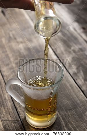 Woman Pouring Freshly Infused Tea