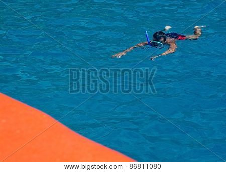 Snorkler and boat
