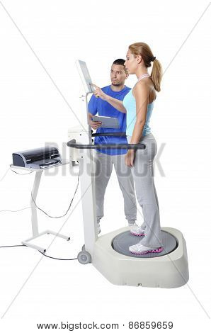 Sports Scientist Doing Balance Assessment With Professional Equipment. Modern Technology.