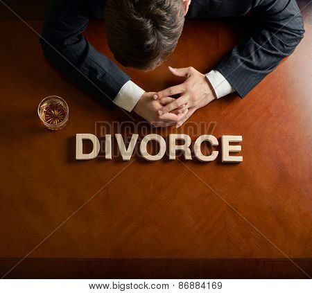 Word Divorce and devastated man composition