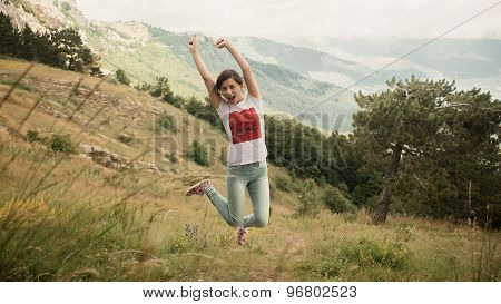 Portrait of happy traveler girl with raised up hands