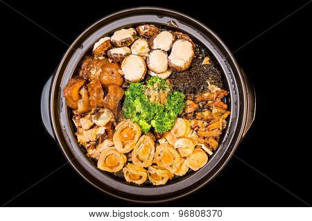 Chinese styled Abalone mixed dish. Also known as Poon Choy in Chinese. Isolated in black.