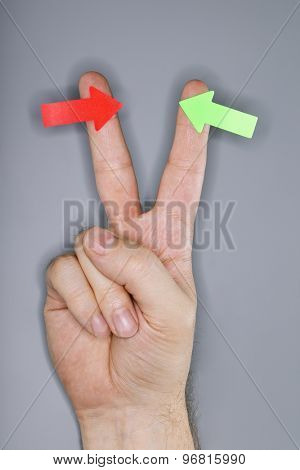 A hand with arrow stickers. Very short depth-of-field and ring flash lighting.
