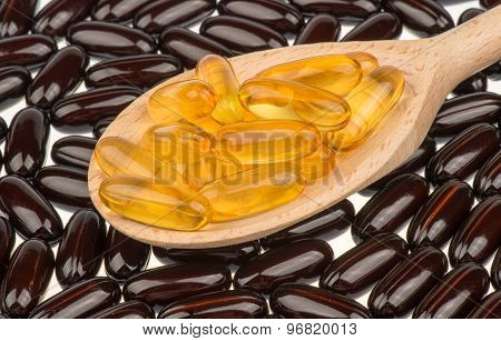 Omega-3 capsules in the spoon.