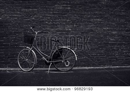 Classic Vintage Hipster Retro Bicycle Leaning Against The Street Wall