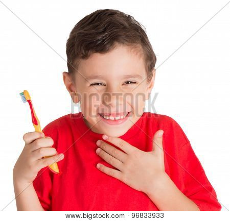 Young boy happily holding a tooth brush ready to brush his teeth