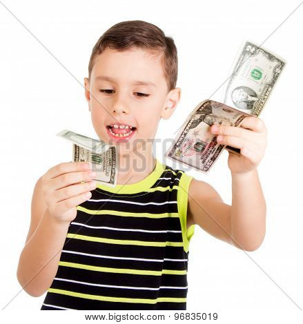 Young boy happily playing with dollars