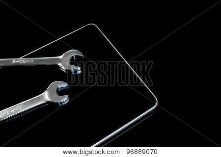 Chrome Fork Wrenches On The Tablet Display Black Isolated