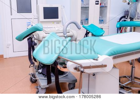 Gynecological Surgery Room With Chair And Equipment In Reproductive Medicine Clinic. Selective Focus