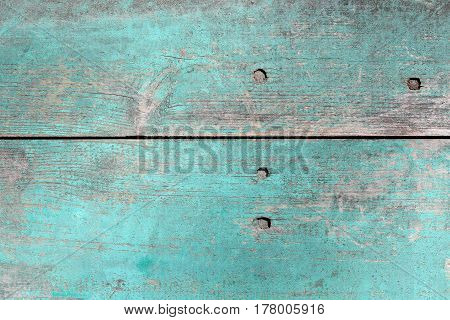 Wooden planks in the old blue paint