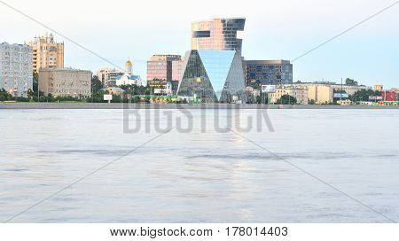 Neva River and Modern building business center on Malookhtinskaya embankment in St.Petersburg before dawn.