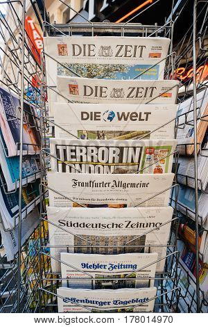 PARIS FRANCE - MAR 23 2017: German newspapers on stand of a press kiosk featuring headlines following the terrorist incident in London at the Westminster Bridge
