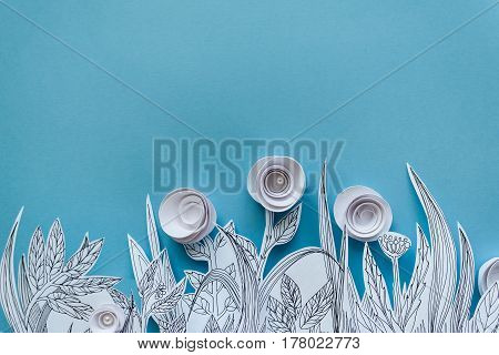 Paper Art And Origami Concept Of Flower Meadow. White Paper Flower On Blue Background