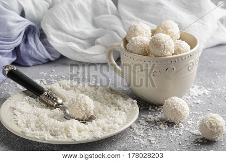 Homemade Coconut Candies In A White Plate On The Table. Sweets. Selective Focus
