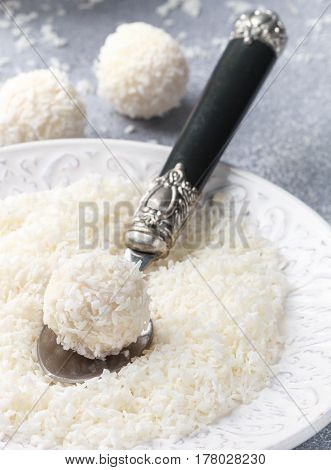 Homemade Coconut Candies In A White Plate On The Table. Sweets. Selective Focus
