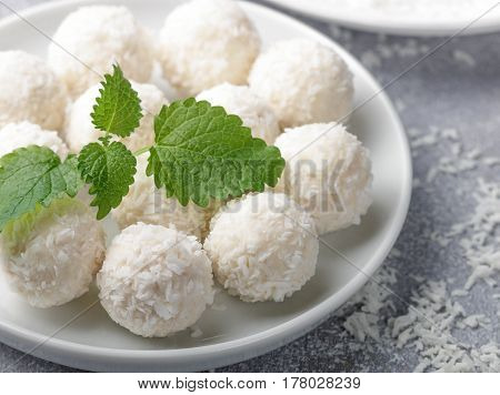 Homemade Coconut Candies In A White Plate On The Table. Sweets. Selective Focus