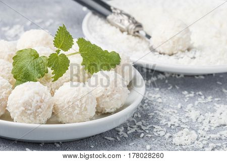 Homemade Coconut Candies In A White Plate On The Table. Sweets. Selective Focus