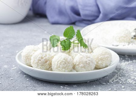 Homemade Coconut Candies In A White Plate On The Table. Sweets. Selective Focus