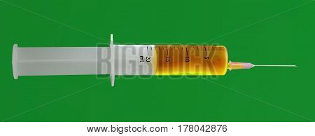 Isolated syringe with needle with yellow liquid on green background