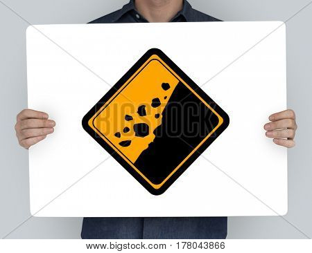 Studio Shoot Holding Banner with Rockfall Beware Sign 