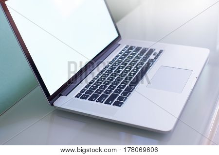 Laptop with white copy space screen .close up seleted focus on keyboard .