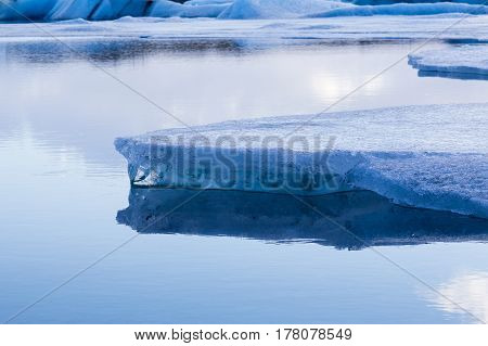 Blue icebergs floating in Jokulsarlon lagoon Iceland winter season landscape background