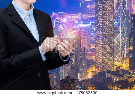 Young business woman is using smart technology of internet of things in smart city for global business connection. Photo design for smart city and smart technology internet of things concept.