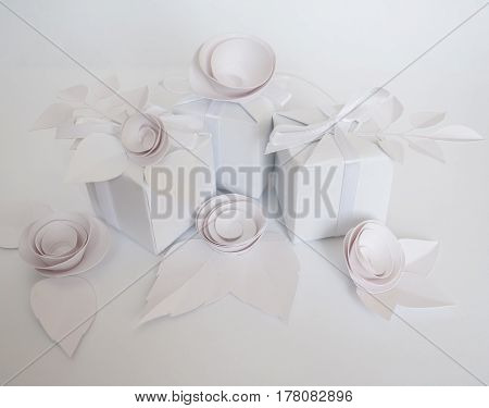 White Gifts And White Paper Flowers