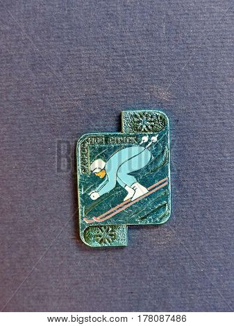 USSR - CIRCA 1980: Badge with a picture of mountain skier and the inscription 
