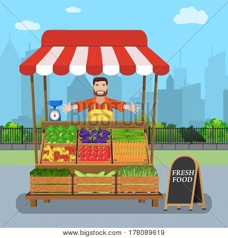 male street vendor selling vegetables from his stall on city street