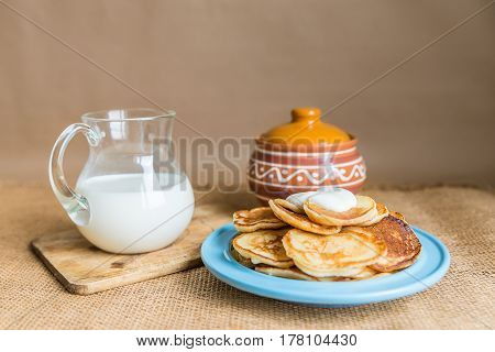 pancakes with jam, sour cream and milk