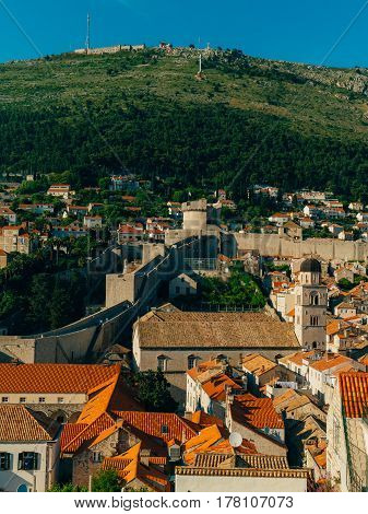 Dubrovnik Old Town, Croatia. Tiled roofs of houses. Church in the city. City View from the wall.