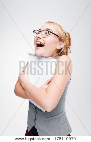Nice young girl in glasses extremely happy and lucky about success and win. Shift expectation, unexpected pleasure, unforeseen success.