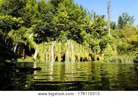 landscape of plitvicka national lake park at sunset unesco heritage site plitvice croatia.