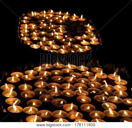 Candles Lit With The Warm Flame During The Religious Ceremony