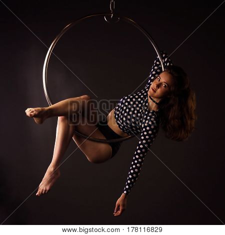 Woman Exercising On Lyra
