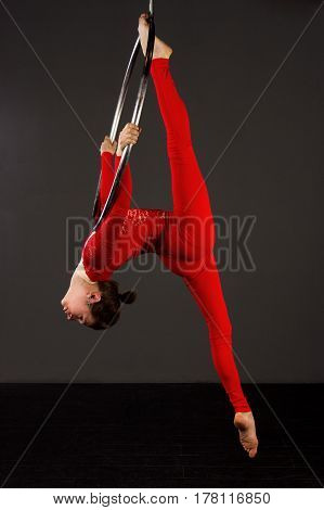 Woman Exercising On Lyra
